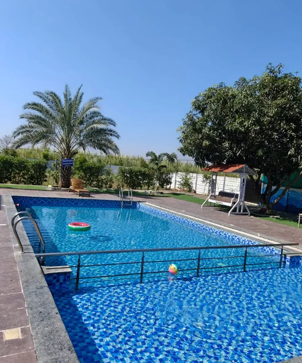 Private swimming pool at Waje Farm House